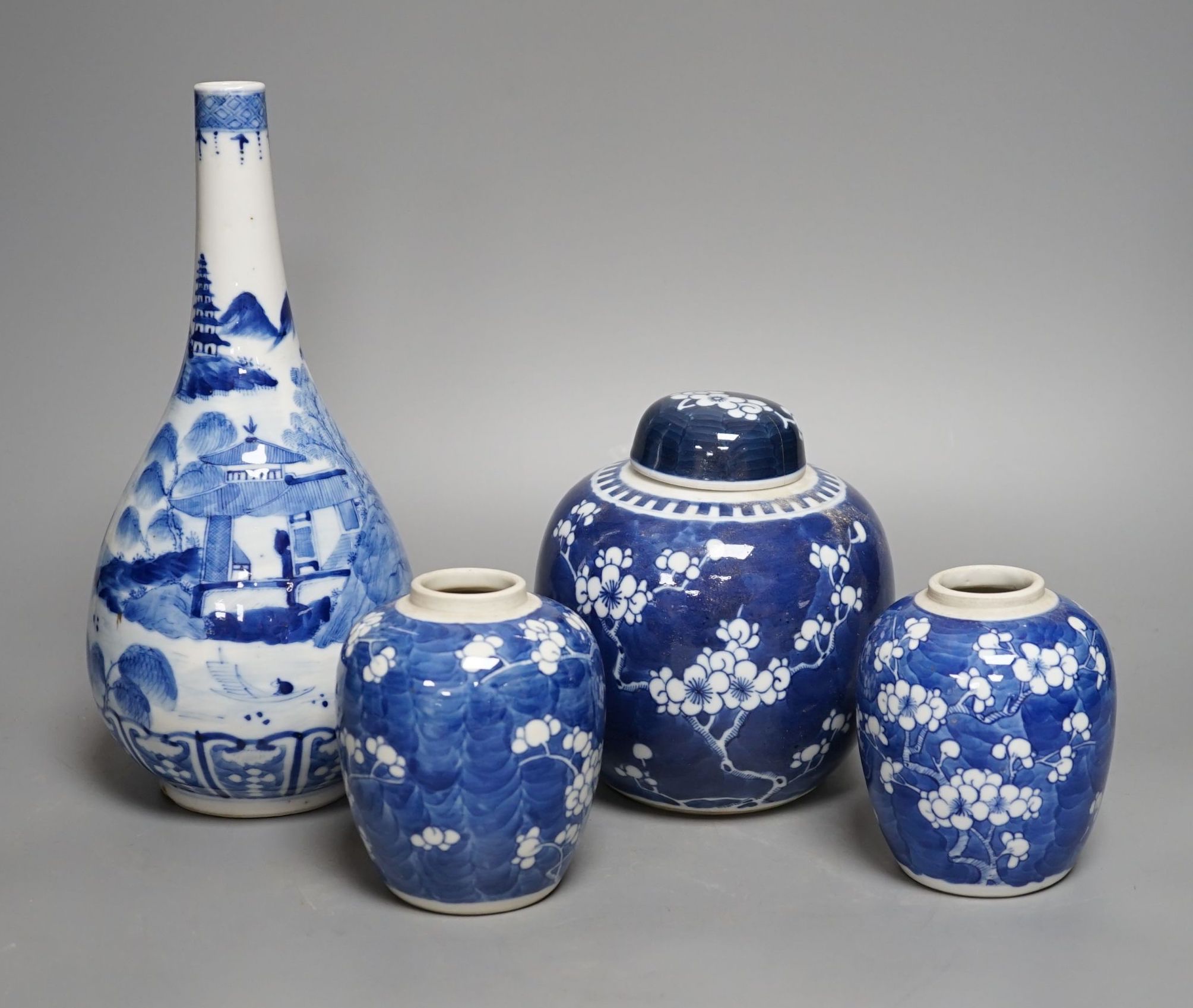 A Chinese blue and white vase and 3 graduated blue and white ginger jars, Vase25 cms high.